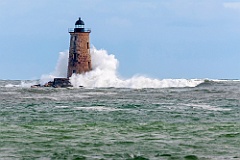 Waves fron High Tides Break Around Whaleback Lighthouse